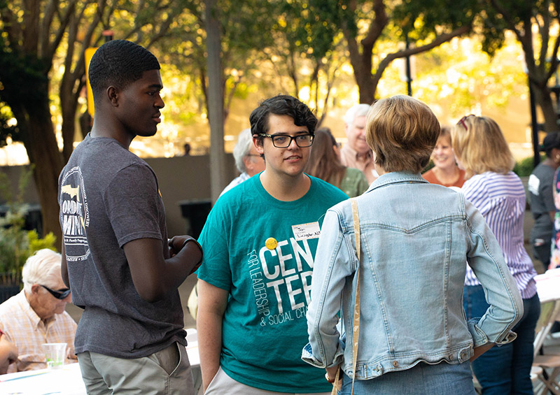 A group of young adults having a conversation